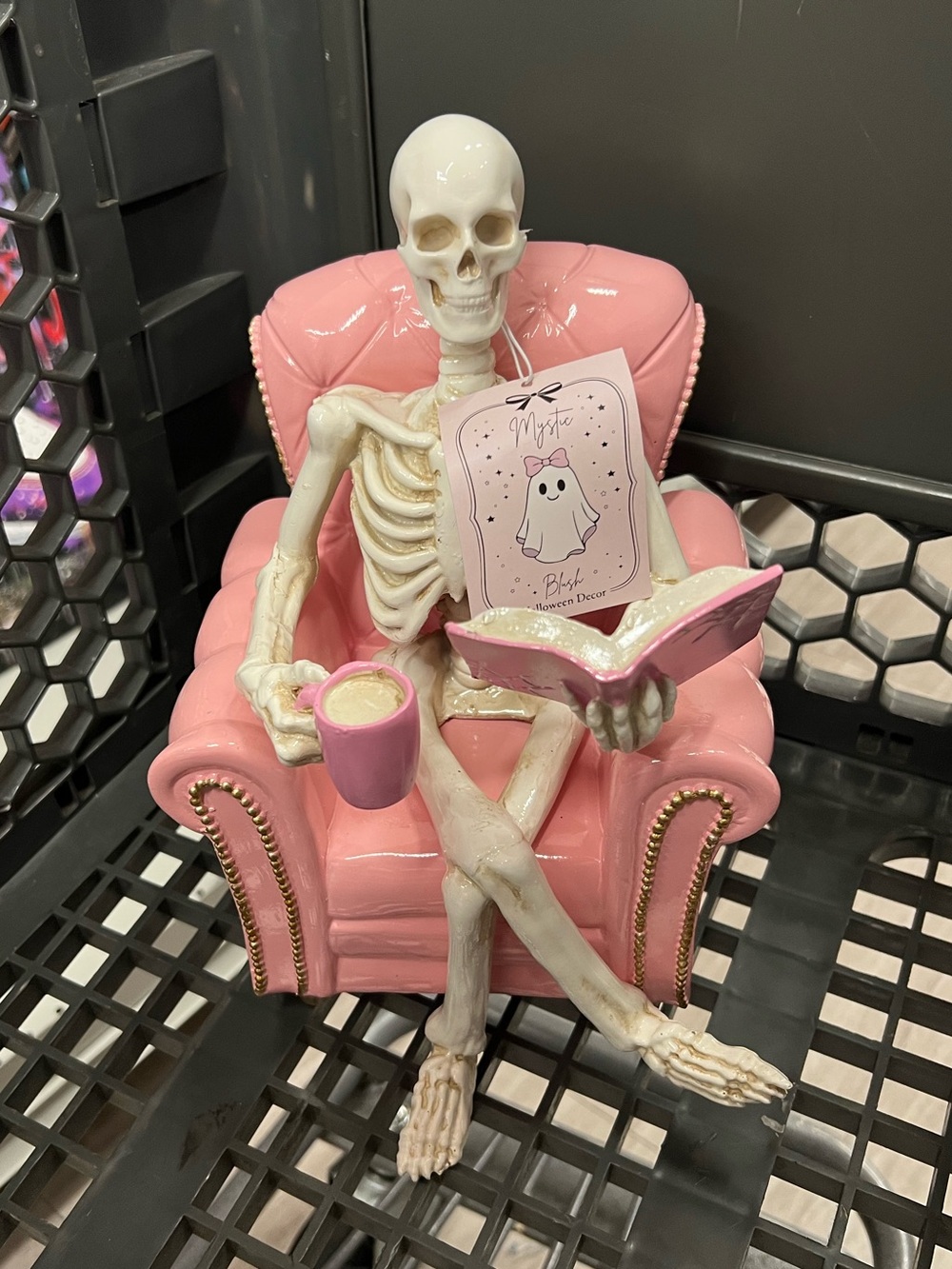 Skeleton Reading Book in Pink Chair Holding Mug Resin Halloween Decor